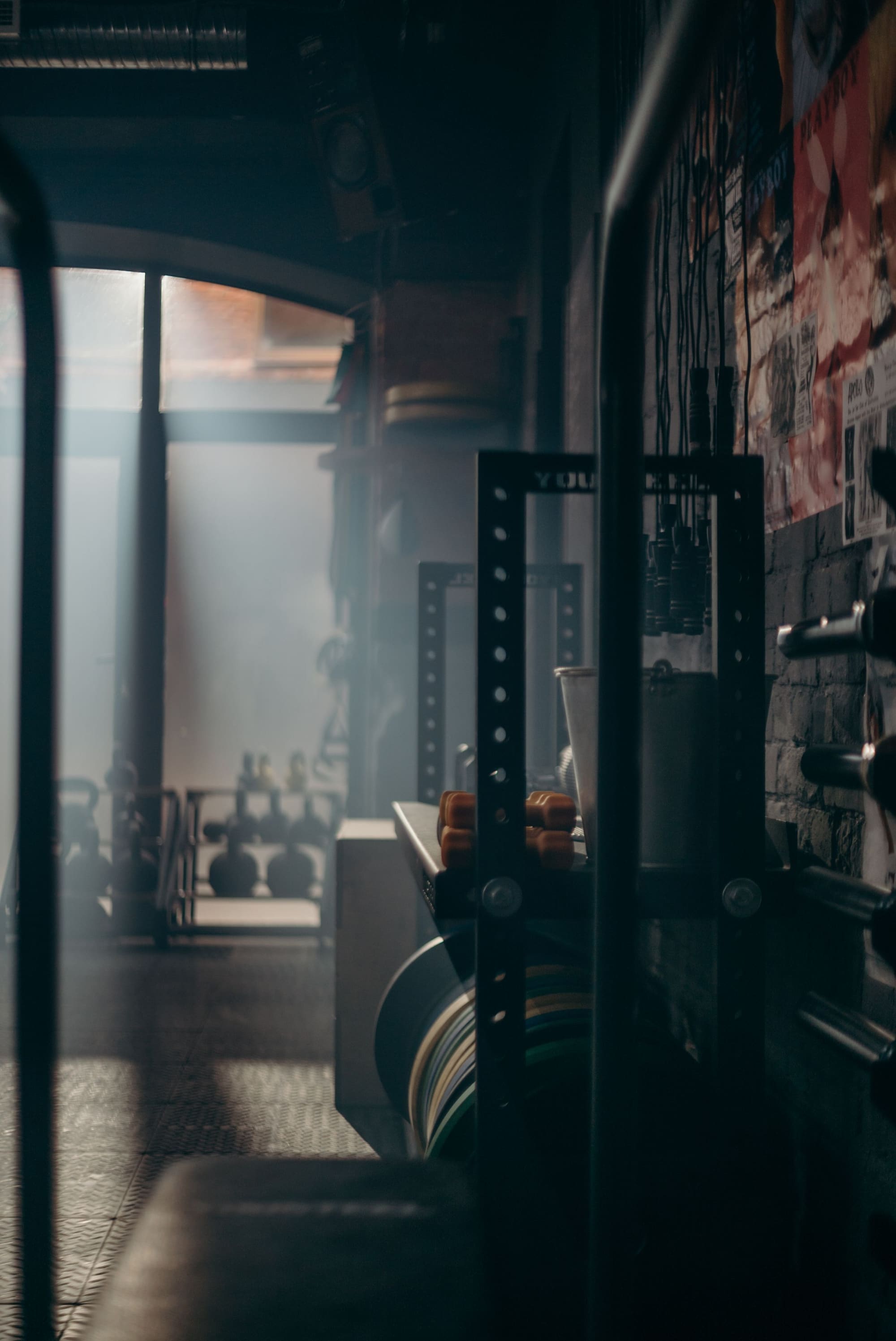 Dark, atmospheric conditioning gym with training equipment